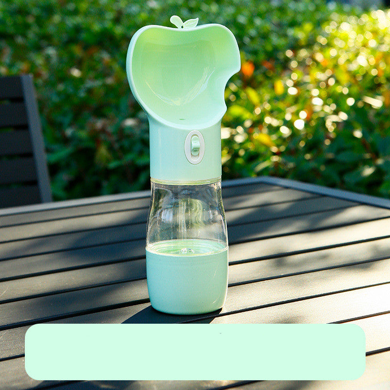 Dog drinking from 2-in-1 travel water and food cup