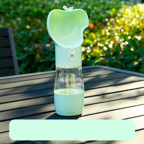 Dog drinking from 2-in-1 travel water and food cup